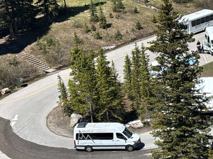 An ABestX shuttle on the Bow Valley Parkway near Banff