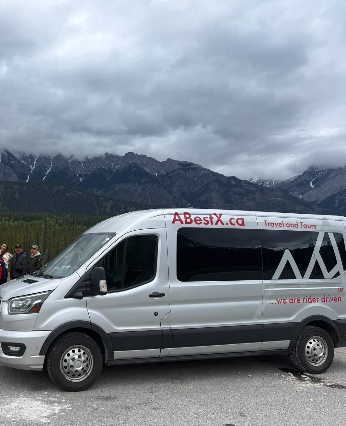 An ABestX van with the Canadian Rockies behind