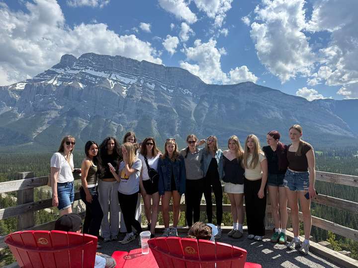 Travellers and red canoes at Lake Louise